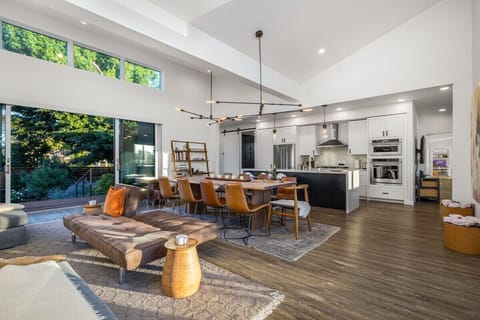 Oversized glass doors open to nature on both sides of the great room.