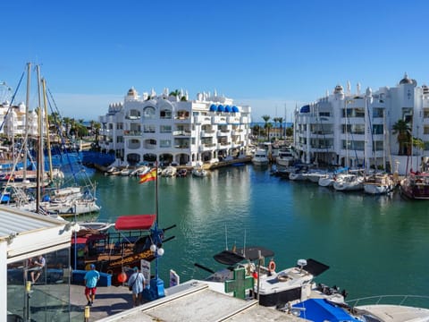 Water, Boat, Building, Sky, Property, Watercraft, Azure, Lake, Vehicle