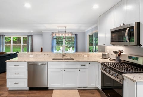 Kitchen includes gas range/oven, dishwasher, built-in microwave and fridge