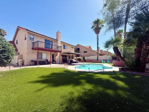 Backyard: Sparkling clean pool is surrounded by desert plants