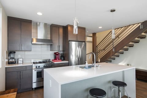 Fix yourself a drink at the kitchen island.