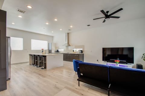 Living room with 78" Samsung TV & Surround Sound