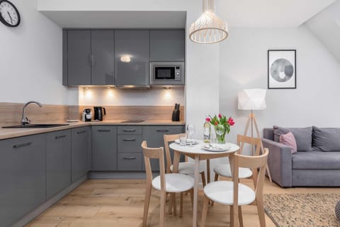 Kitchenette with dishwasher.