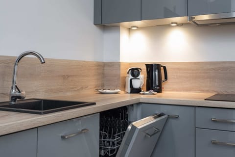 Kitchenette with coffee machine.