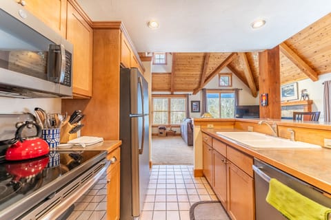 Full size kitchen with stainless steel appliances.