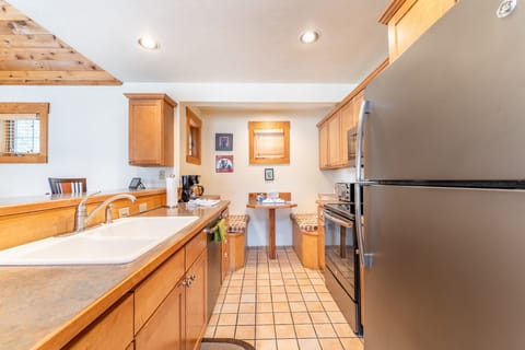 Full size kitchen with stainless steel appliances.