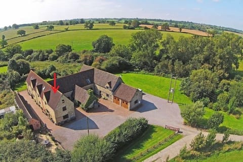 Aerial shot of Highwood Farm with the arrow denoting Lavender Cottage.