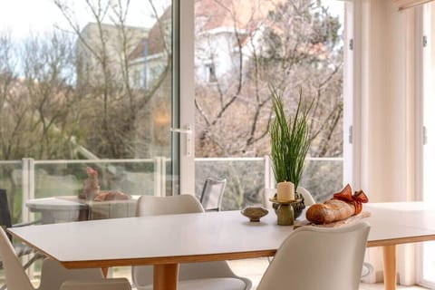 Bright and spacious living room with family dining area