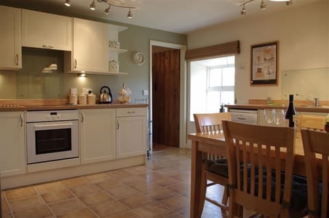 Kitchen with dining area at Hill Top Cottage in Walden dale near West Burton in the Yorkshire Dales