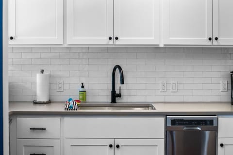 Updated kitchen: new cabinets, counter tops, and backsplash.