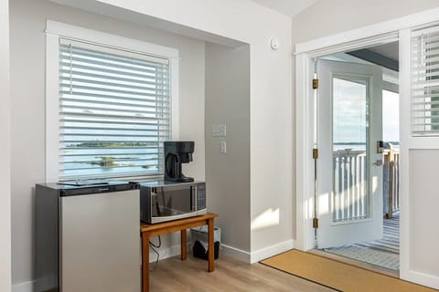 Mini fridge, microwave and coffee maker in master bedroom