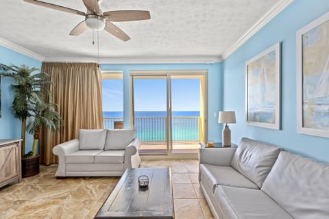 Relax in this coastal living room with ocean views and natural light.