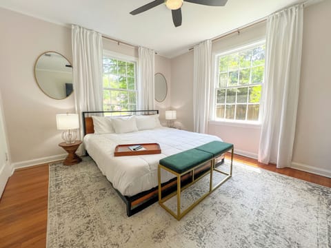 Unwind in a luxurious escape where technology and comfort come together in perfect harmony with a plush queen-sized bed and a smart TV that invites you to stream, snooze, and soak in the peace of a serene bedroom.