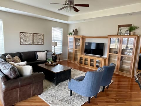 Living Room.  Plenty of seating on the large leather sofa and 2 accent chairs.  