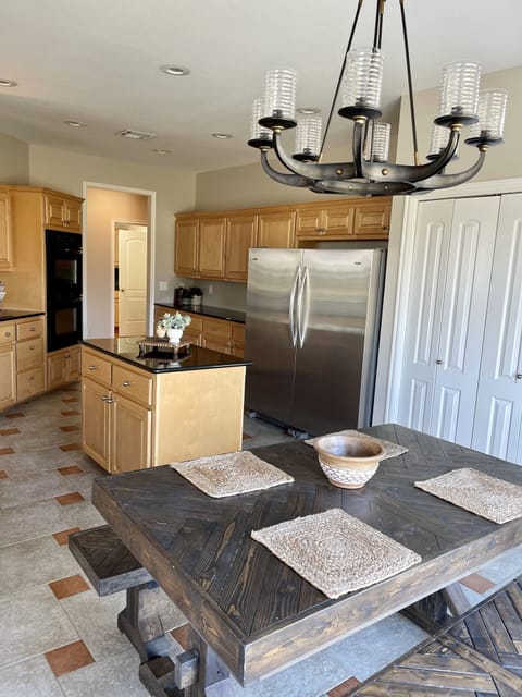 Large kitchen with oversized refrigerator and freezer