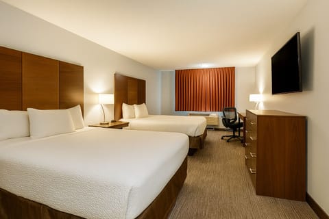 Unwind on crisp linens in a spacious double-queen room.