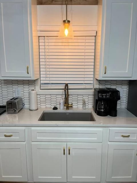 The kitchen has a drip coffee pot combo with K- cup 