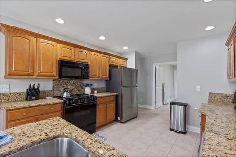 Electric stove/oven. 4 burners Stainless fridge with ice maker