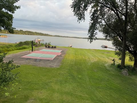 150’ of shore line, private pickleball court, basketball court. Large fire pit.