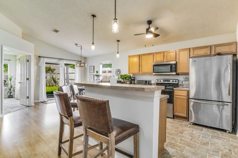 Four barstools at the kitchen, providing extra seating for guests.