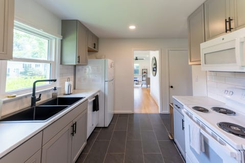 The kitchen also includes a crock pot, coffee maker, toaster, and more!