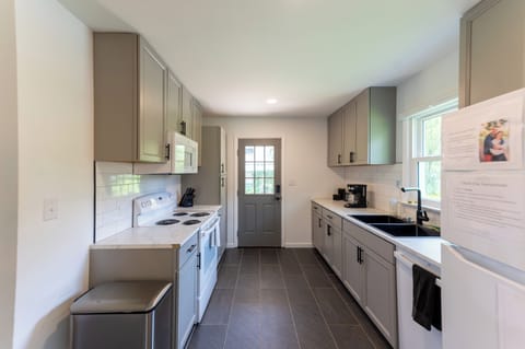 The kitchen basics are included: plates, bowls, cups, flatware, etc.