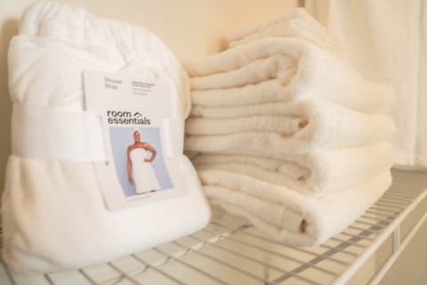 Extra towels and linings, and shower robe in the walk in closet in bedroom.