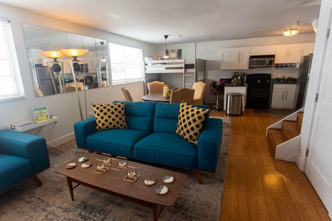 Large living room, dining area, bunk bed and kitchen