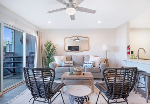 living room with pull-out sofa, patio