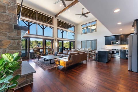  two-story great room with kitchen, living and dining room with view to lake.