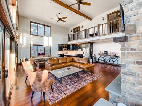 The main gathering area is all about togetherness—plenty of space to hang out, play games, or chat by the cozy gas fireplace (shown from another angle). Cook up a feast in the full kitchen and enjoy it in the inviting dining area.