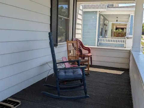 front porch with rockers and table (in summer!)