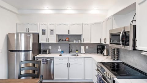 This newly remodeled chefs kitchen features brand new appliances, fully stocked with all the cookware and kitchen utensils.