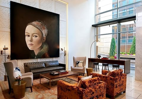 Settle into stylish seating beneath soaring windows and art.