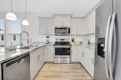 Updated kitchens with stainless steel appliances.
* Both units are identical