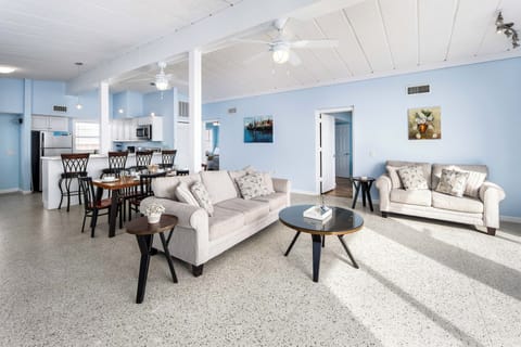 Living Room - Enjoy lounging and watching TV on these comfy sofas