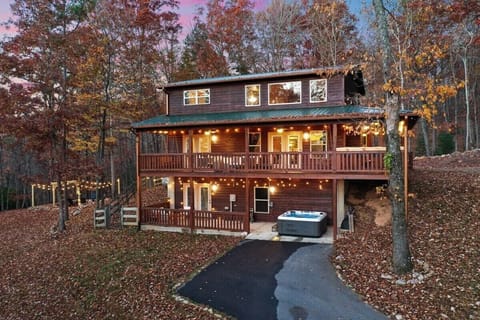 Wrap around top porch with the hot tub on the bottom porch