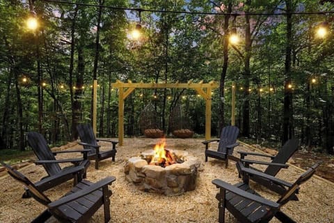 Enjoy the fire pit  pergola with 6 chairs and two swings!