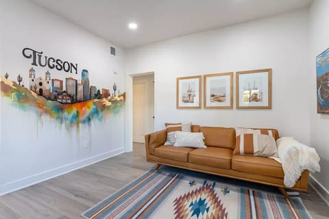 Living Room with Article sofa and collection of art showcasing Arizona. 🌵