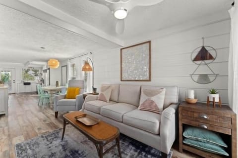 The peach has an open concept kitchen, dining, and living room area 