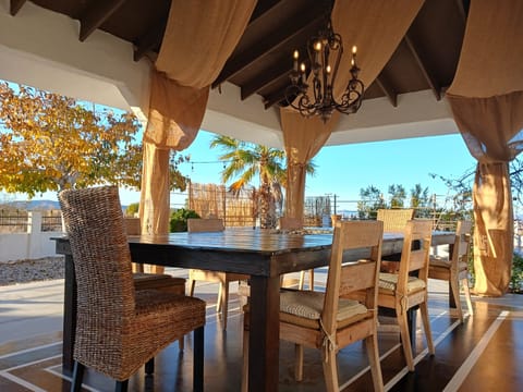 Outdoor firetable with camp fire in the middle seats up to 16 people. 
