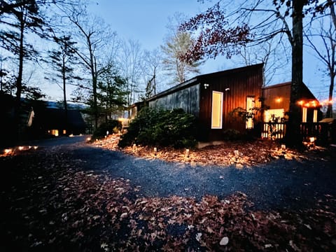View of the driveway/back of the house with mountains in the background.