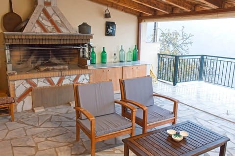 Outdoor Dining Table Under the Roofed Patio – Ideal setting for breakfast or dinner in the open air.