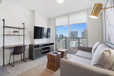 Cozy living area with modern seating and city views.