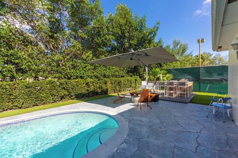 Terrace and fire pit next to the sparkling heated pool.