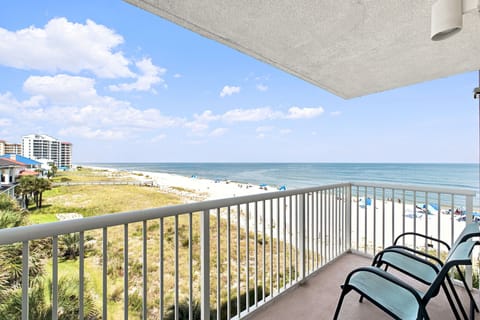 Sandy Key 411- Step onto your private balcony and drink in the stunning oceanfront panorama. Watch the waves roll in, feel the sea breeze, and settle into your chair for pure coastal bliss.