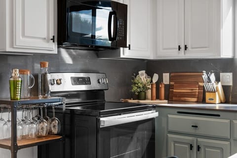 Electric stove, microwave and toaster.