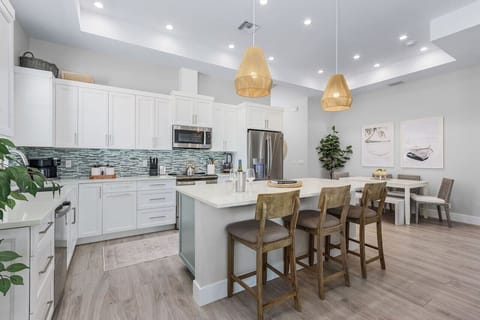 Chat with the chef as they dally in this modern kitchen - induction stove, ice maker fridge