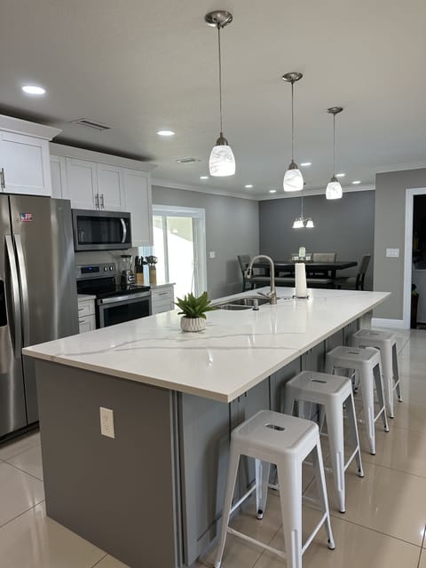 Stainless steel appliances and fully stocked kitchen with everything you need.