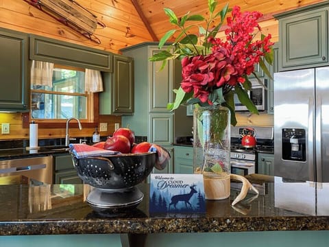 The open plan features a spacious gourmet kitchen…